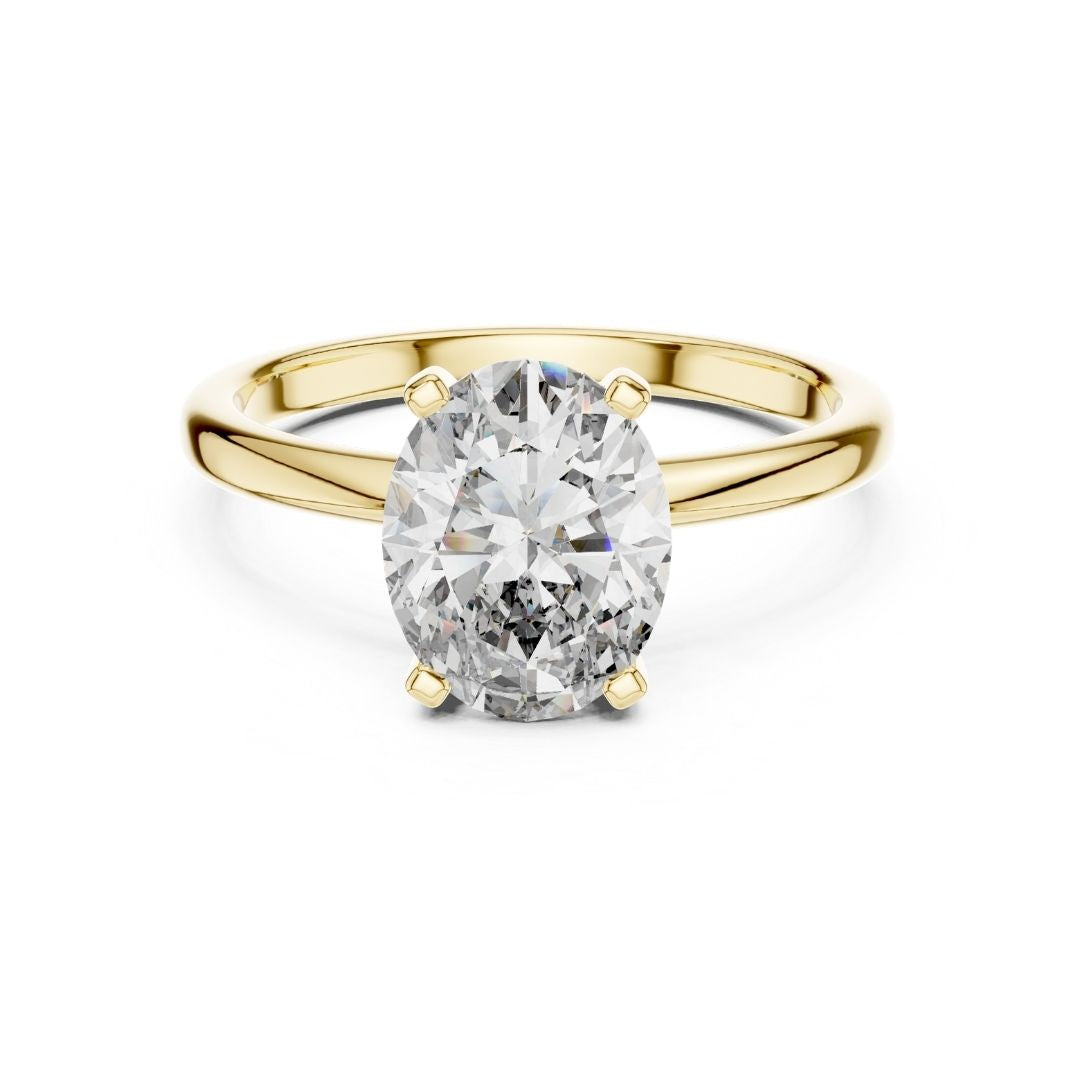 Gold ring with a large moissanite diamond on a white background
