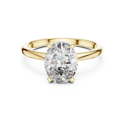 Gold ring with a large moissanite diamond on a white background