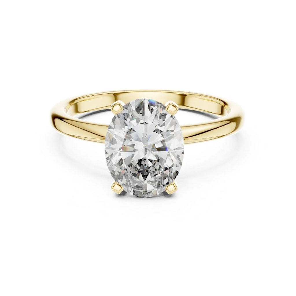 Gold ring with a large moissanite diamond on a white background