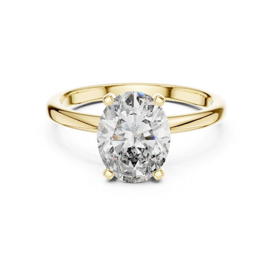 Gold ring with a large moissanite diamond on a white background
