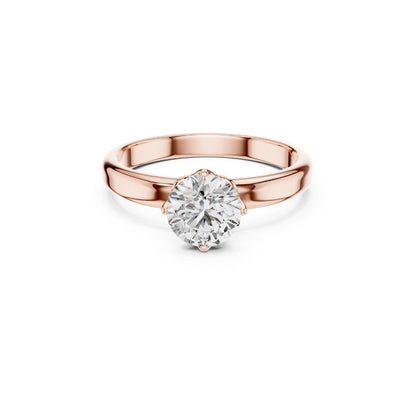 Rose gold ring with a 1ct Moissanite diamond on a white background