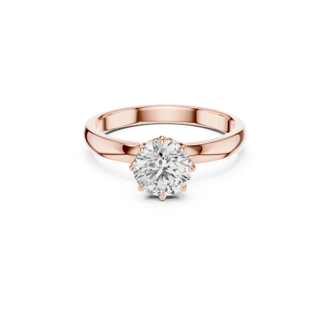 Rose gold ring with a 1ct moissanite diamond on a white background