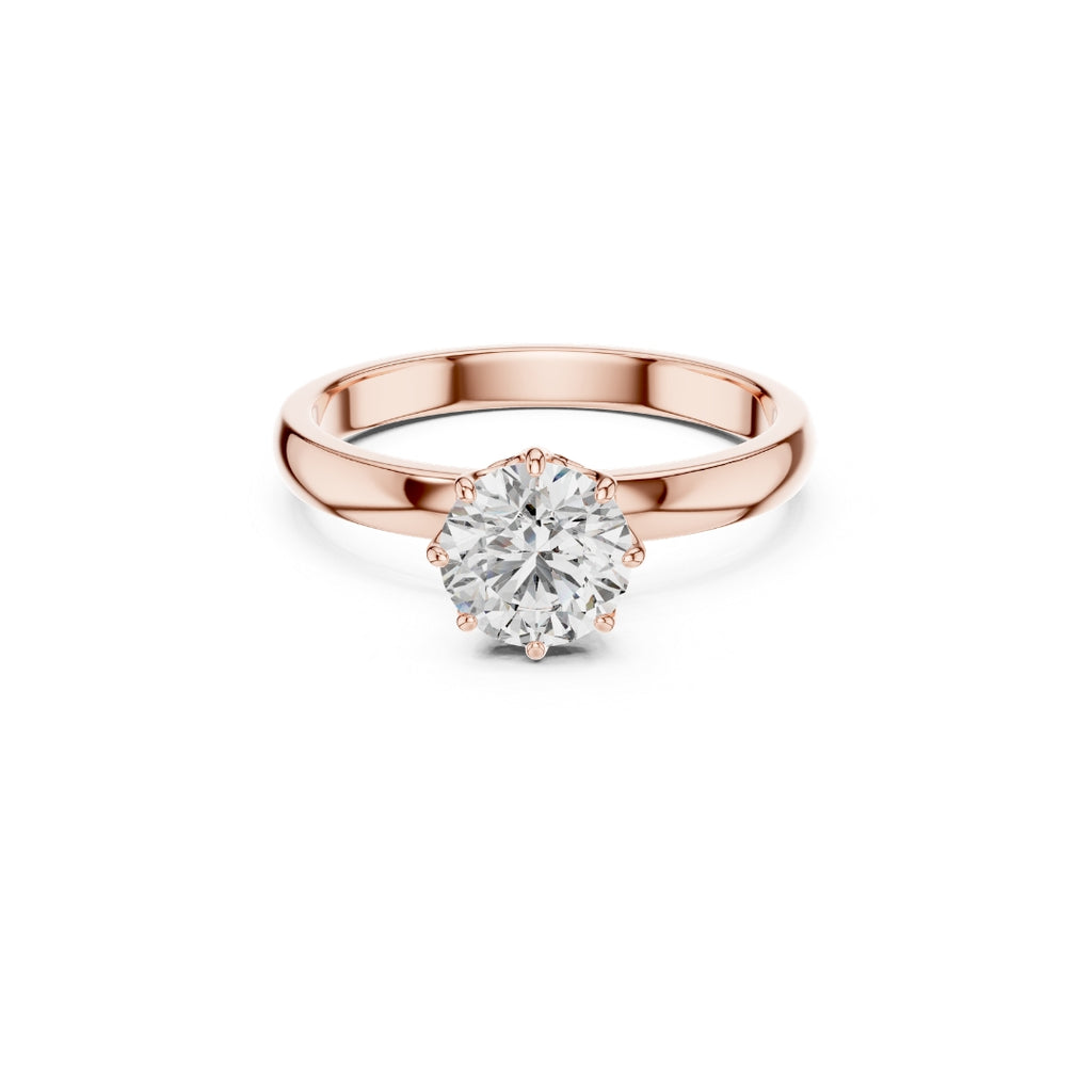 Rose gold ring with a 1ct moissanite diamond on a white background