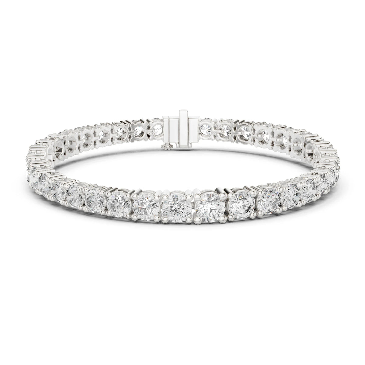 A diamond tennis bracelet in a silver-toned metal setting, featuring a continuous row of round and baguette-cut  moissanite diamonds with a rectangular clasp, shown on a plain white background.