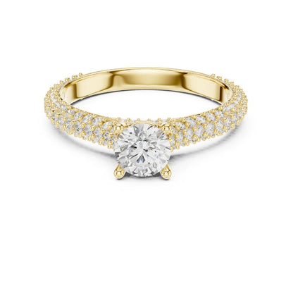 Gold ring with a moissanite diamond on a white background