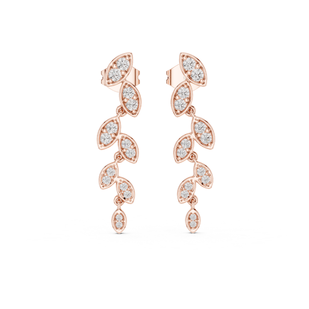 Rose gold earrings with moissanite diamond accents on a white background