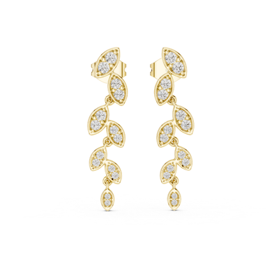Gold earrings with moissanite diamond-like stones on a white background