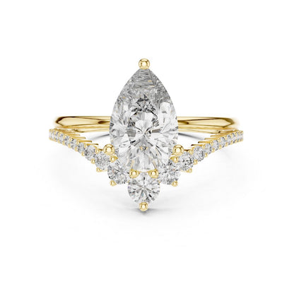 Gold ring with a pear-shaped moissanite diamond on a white background