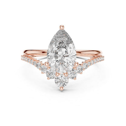 Rose gold ring with a pear-shaped moissanite diamond on a white background
