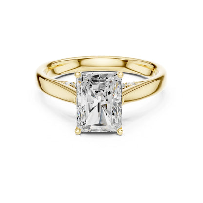 Gold ring with a large moissanite diamond on a white background