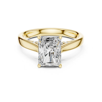 Gold ring with a large moissanite diamond on a white background