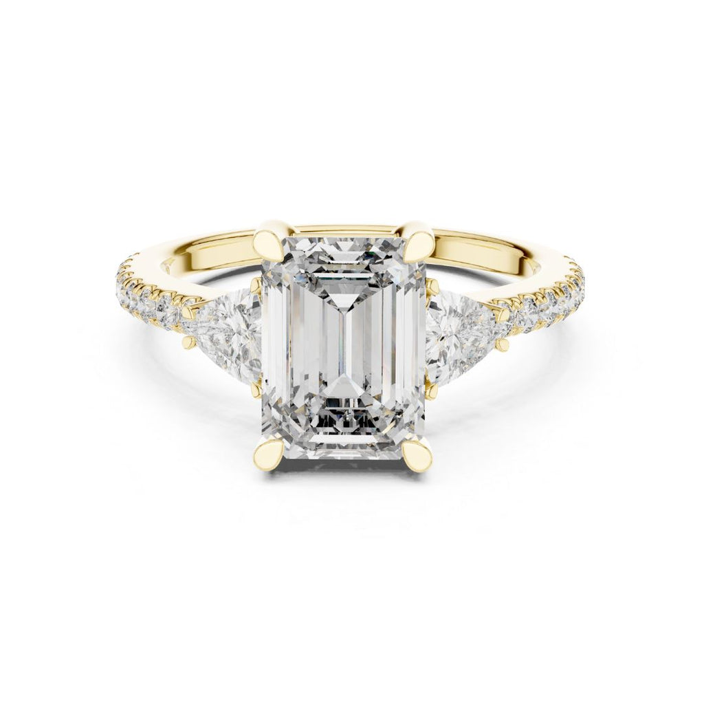 Gold ring with a large moissanite  diamond and smaller diamonds on the band against a white background