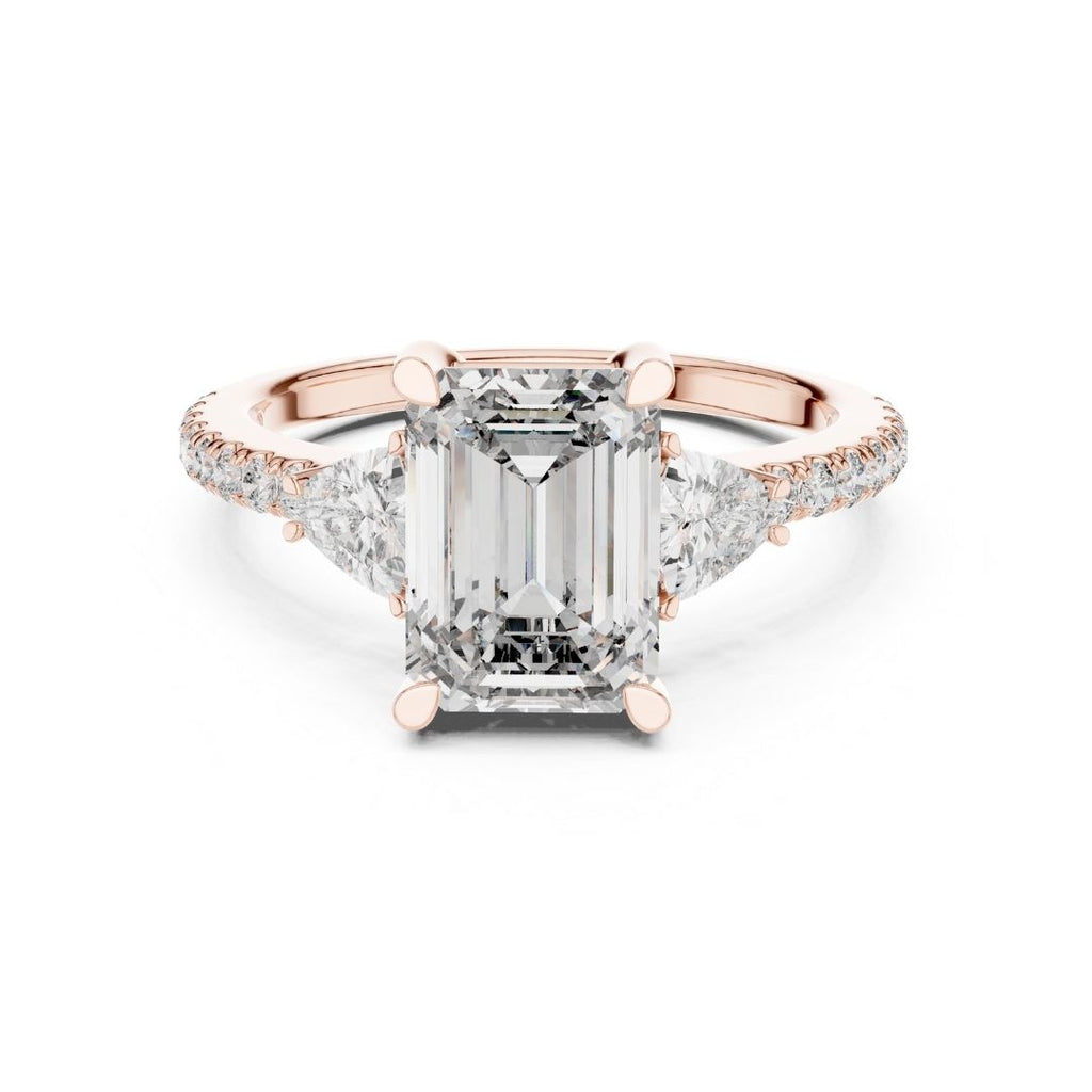 Rose gold ring with a large moissanite  diamond and smaller diamonds on the band against a white background