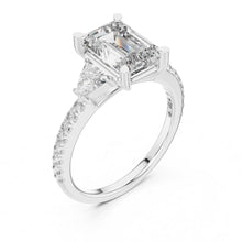 Load image into Gallery viewer, moissanite Diamond ring with a central emerald-cut diamond and smaller diamonds on a white background