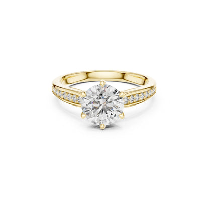Gold ring with a large Moissanite diamond and smaller Moissanite diamonds on the band against a white background