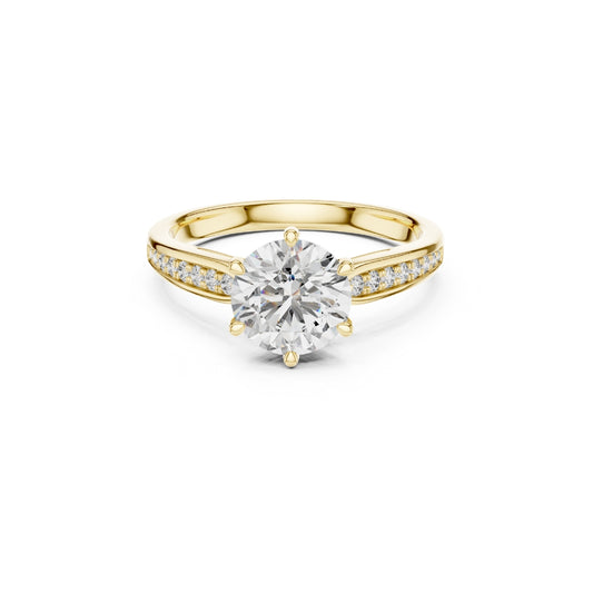 Gold ring with a large Moissanite diamond and smaller Moissanite diamonds on the band against a white background