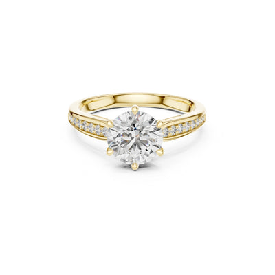 Gold ring with a large Moissanite diamond and smaller Moissanite diamonds on the band against a white background