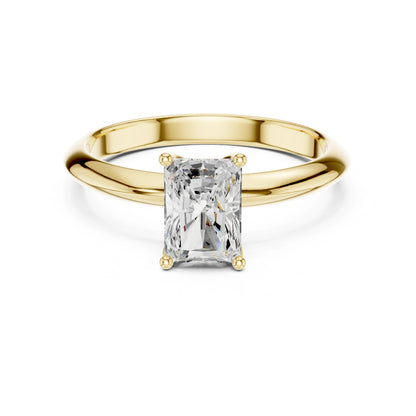 Gold ring with a rectangular moissanite diamond on a white background