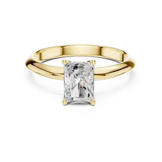 Gold ring with a rectangular moissanite diamond on a white background