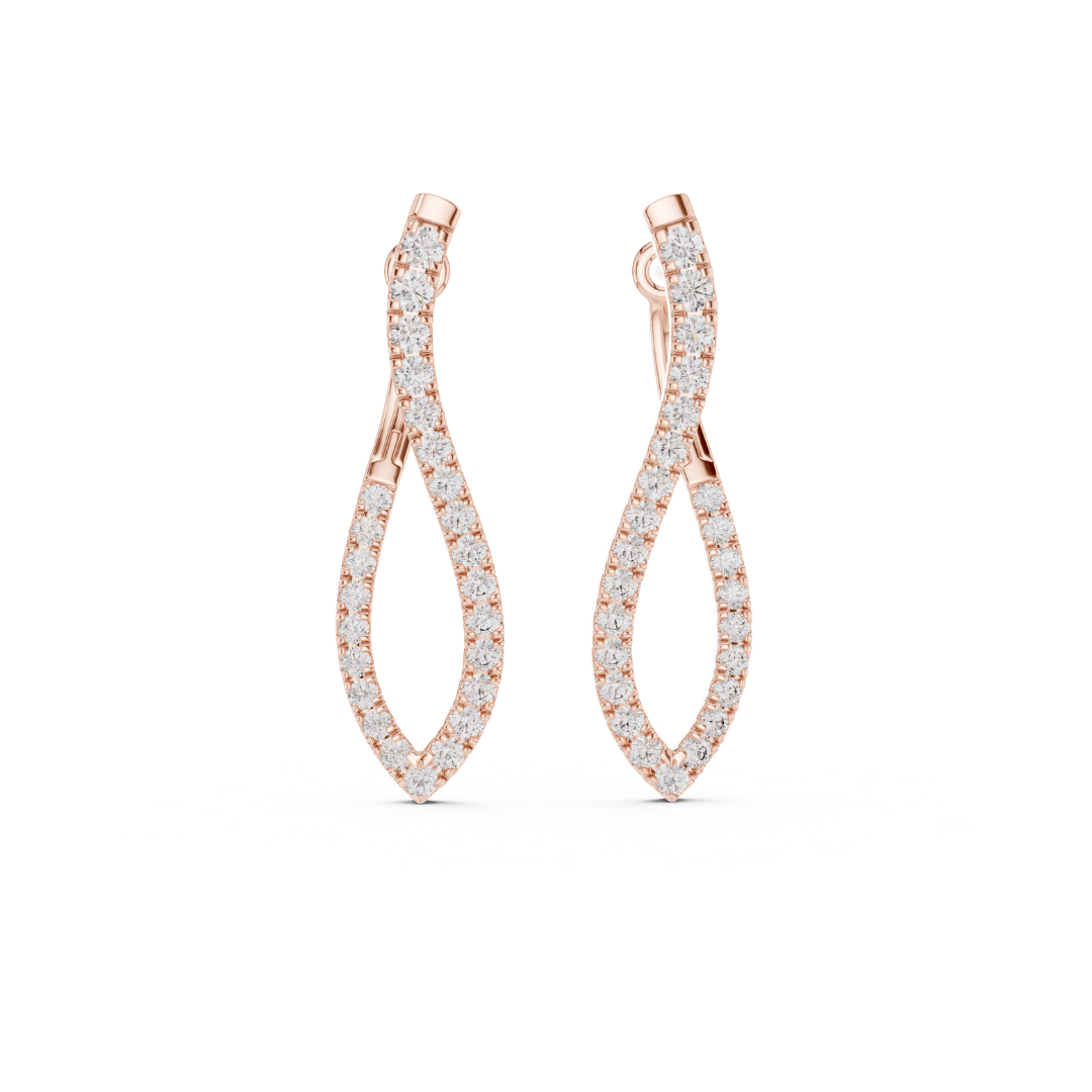 Rose gold earrings with moissanite diamond accents on a white background