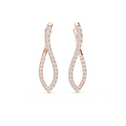 Rose gold earrings with moissanite diamond accents on a white background