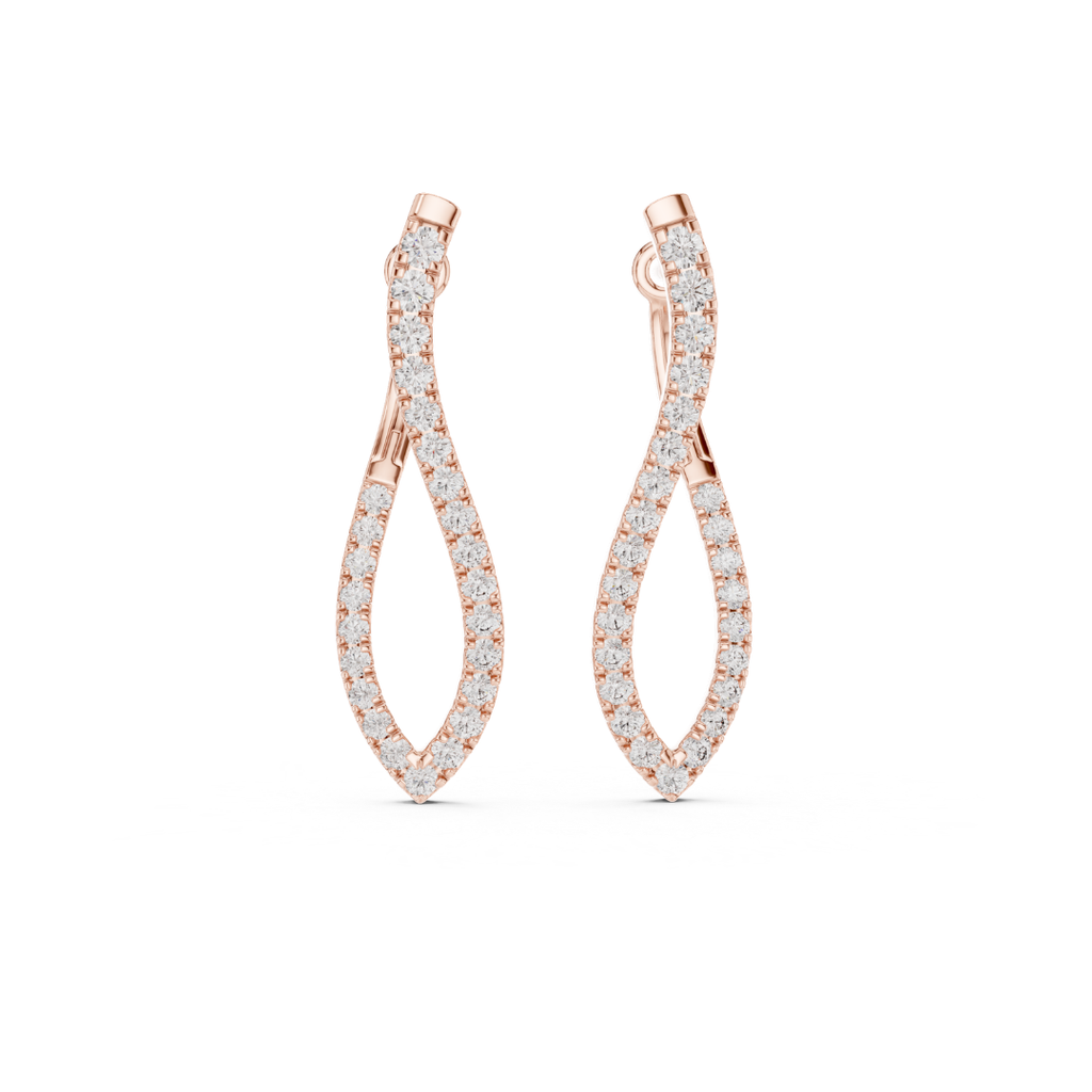 Rose gold earrings with moissanite diamond accents on a white background