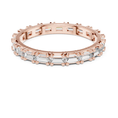 Rose gold and moissanite  diamond ring on a white background