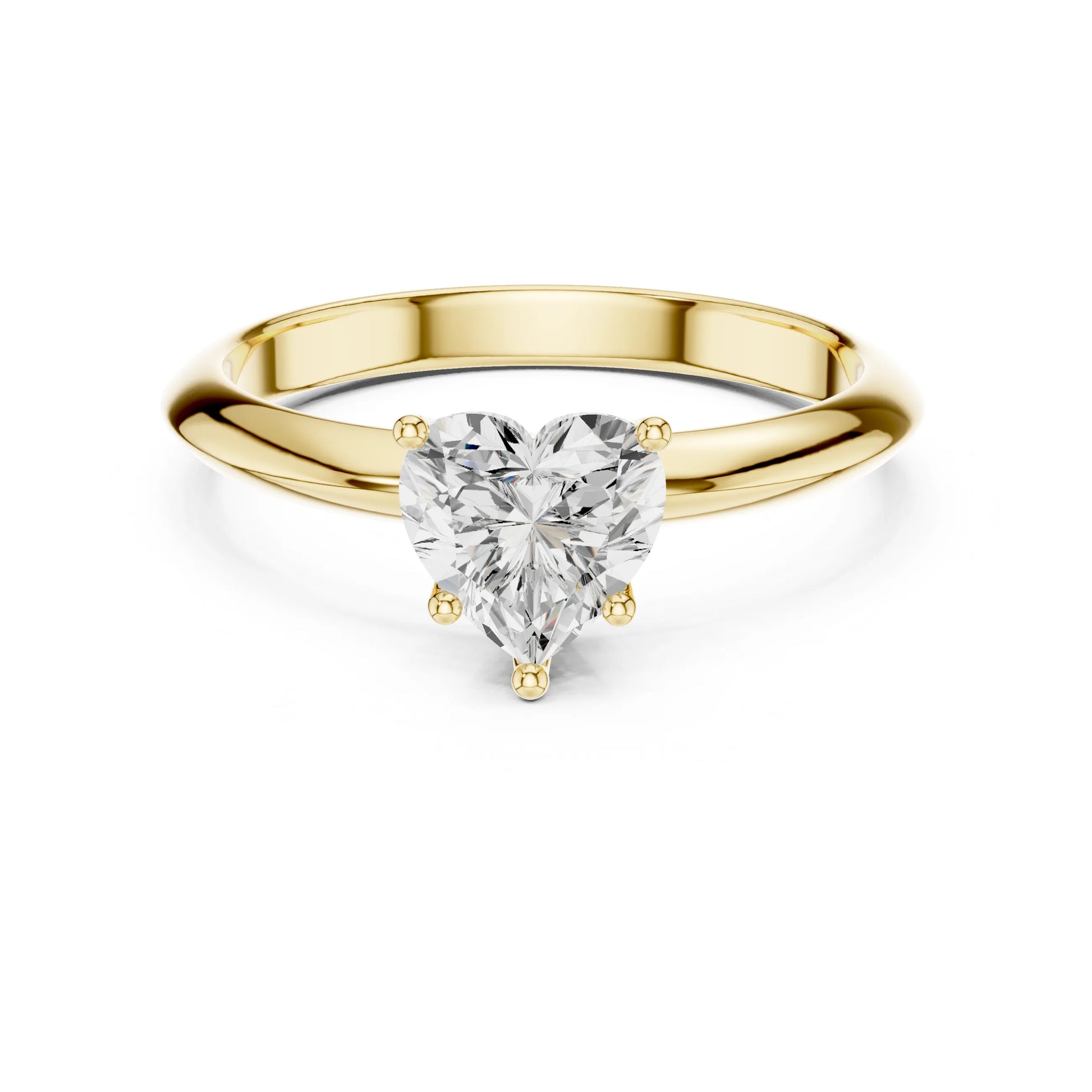 Gold ring with a heart-shaped moissanite diamond on a white background