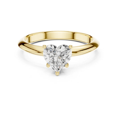 Gold ring with a heart-shaped moissanite diamond on a white background