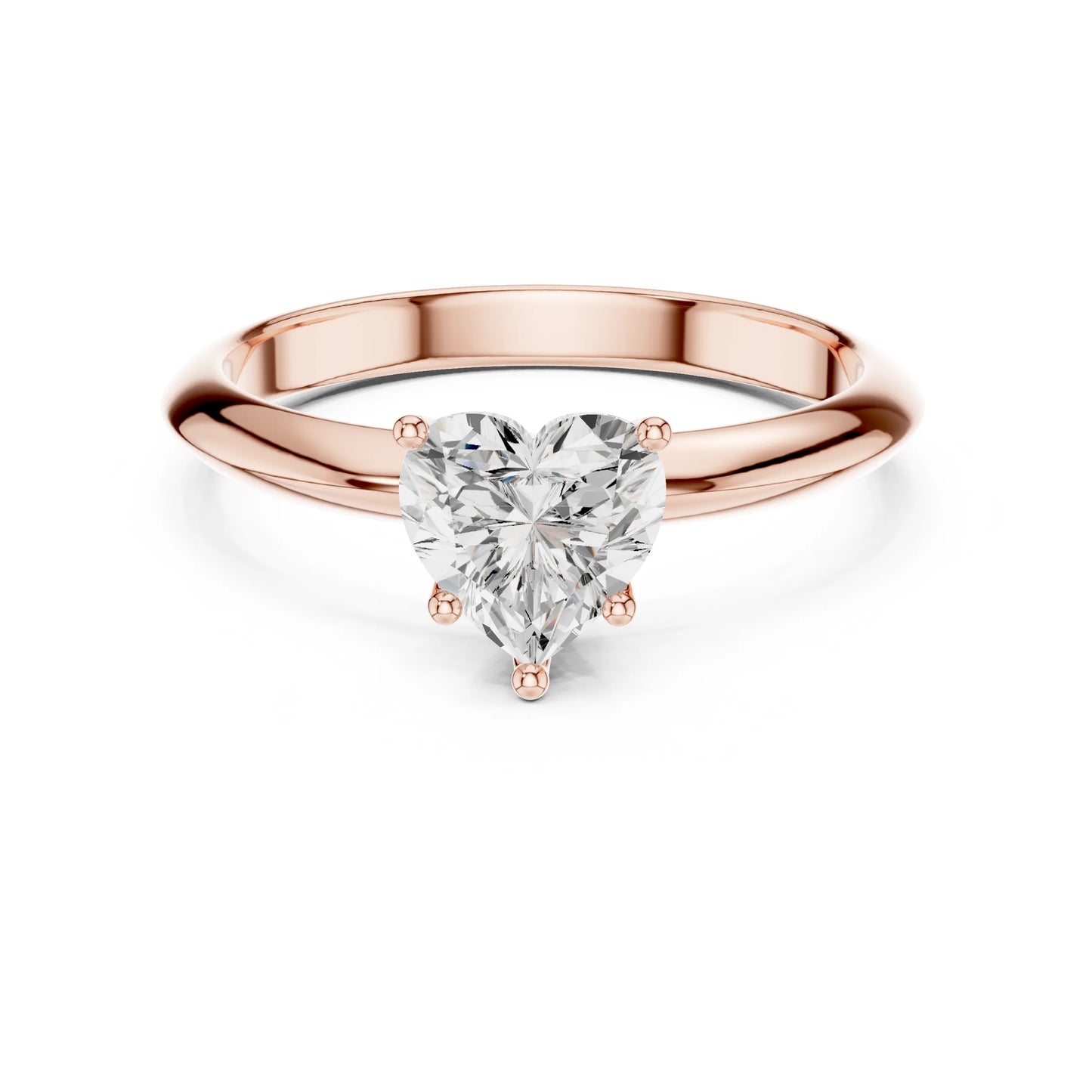 Rose gold ring with a heart-shaped moissanite diamond on a white background