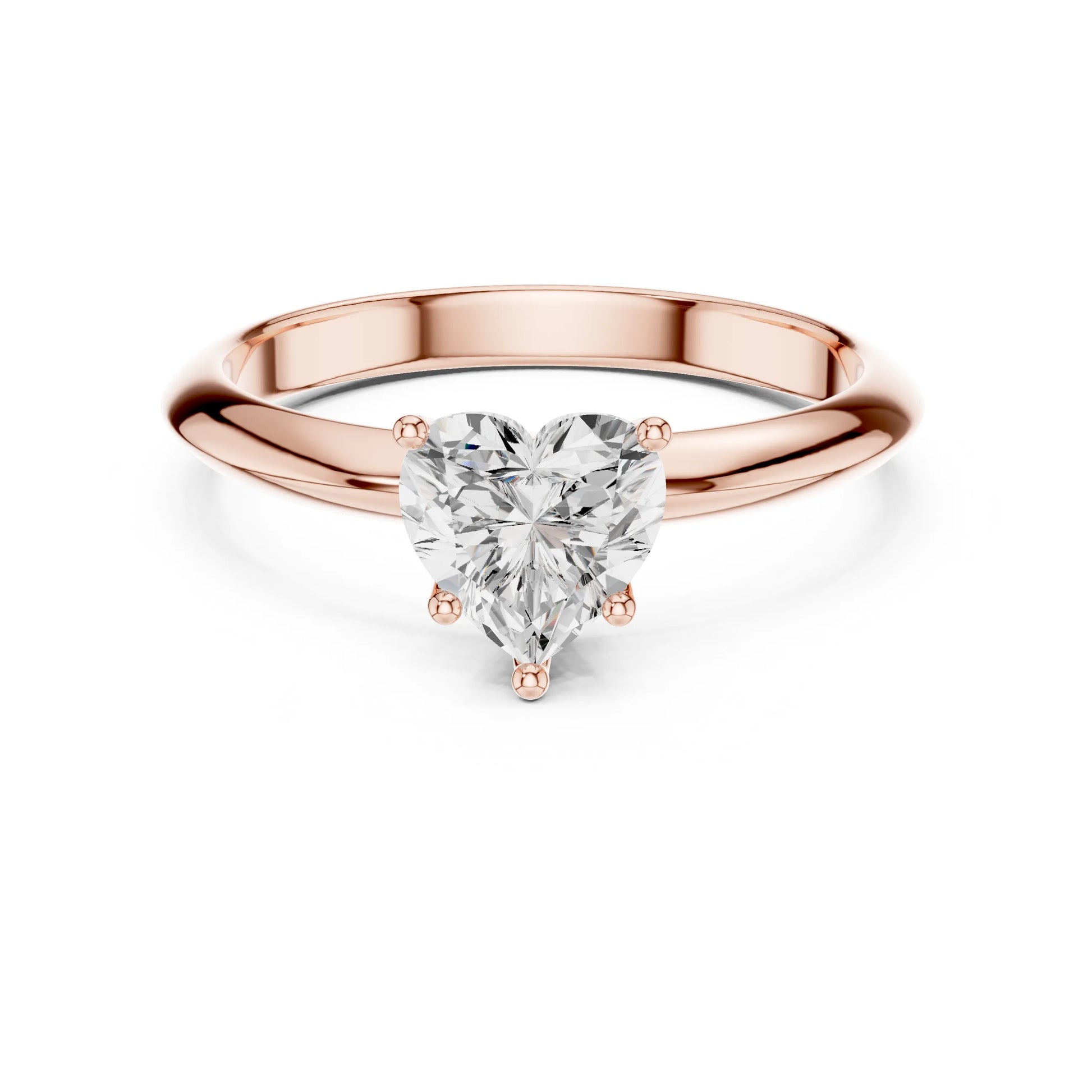 Rose gold ring with a heart-shaped moissanite diamond on a white background