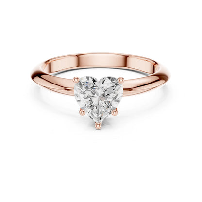 Rose gold ring with a heart-shaped moissanite diamond on a white background