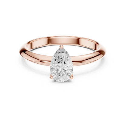 Rose gold ring with a pear-shaped moissanite diamond on a white background
