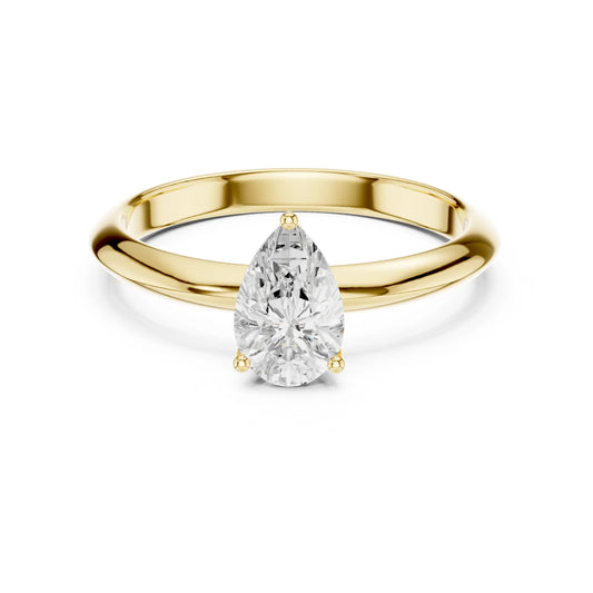 Gold ring with a pear-shaped moissanite diamond on a white background