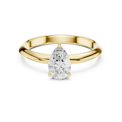 Gold ring with a pear-shaped moissanite diamond on a white background