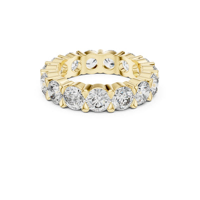 Gold ring with multiple Moissanite diamonds on a white background