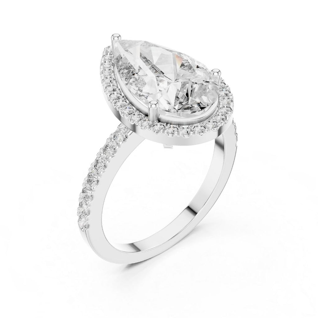 moissanite Diamond ring with a pear-shaped center stone on a white background