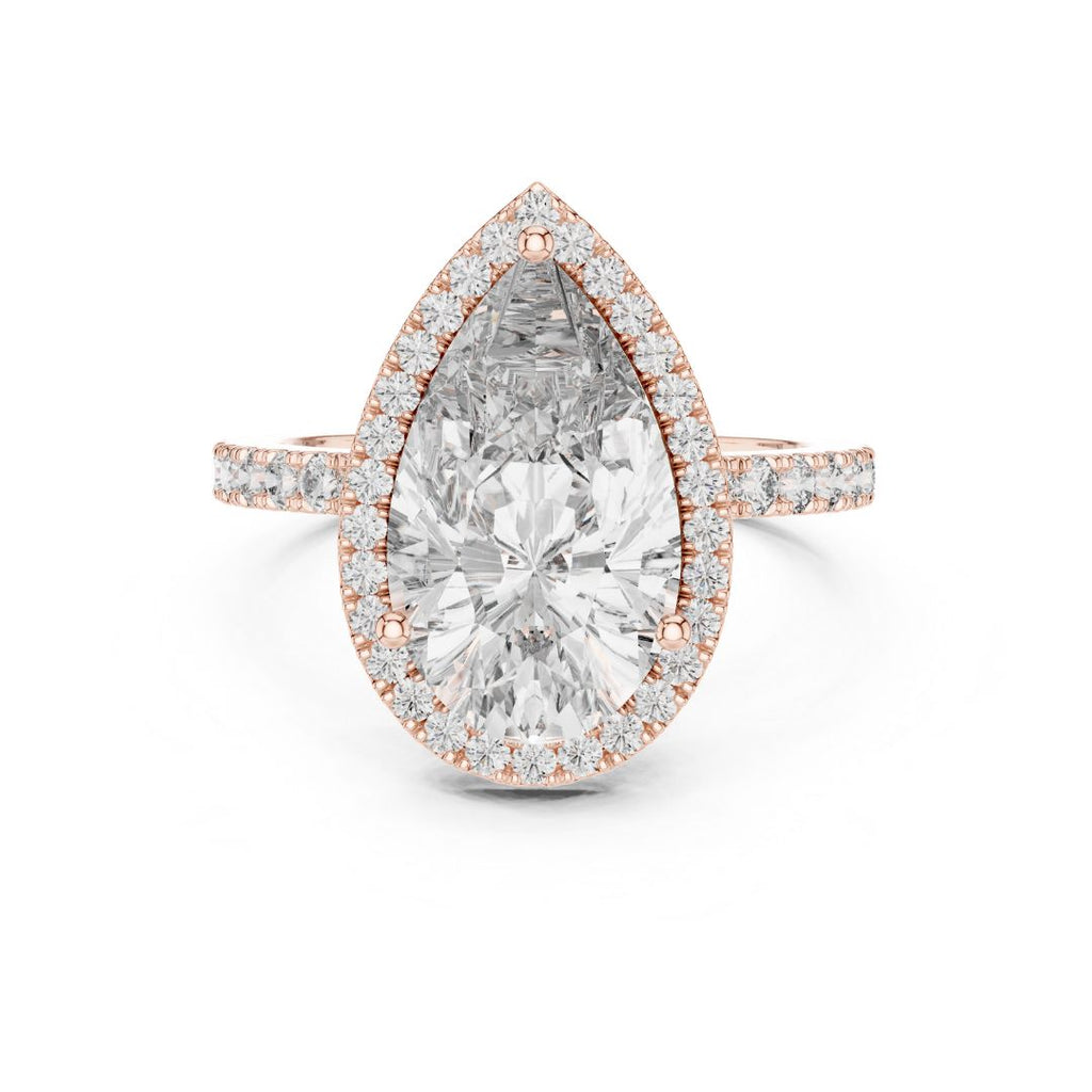 Rose gold ring with a pear-shaped moissanite diamond on a white background