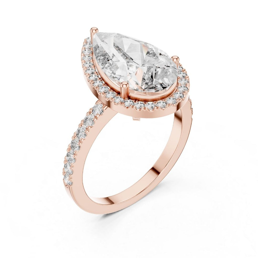 Rose gold ring with a large pear-shaped moissanite diamond and smaller diamonds on a white background