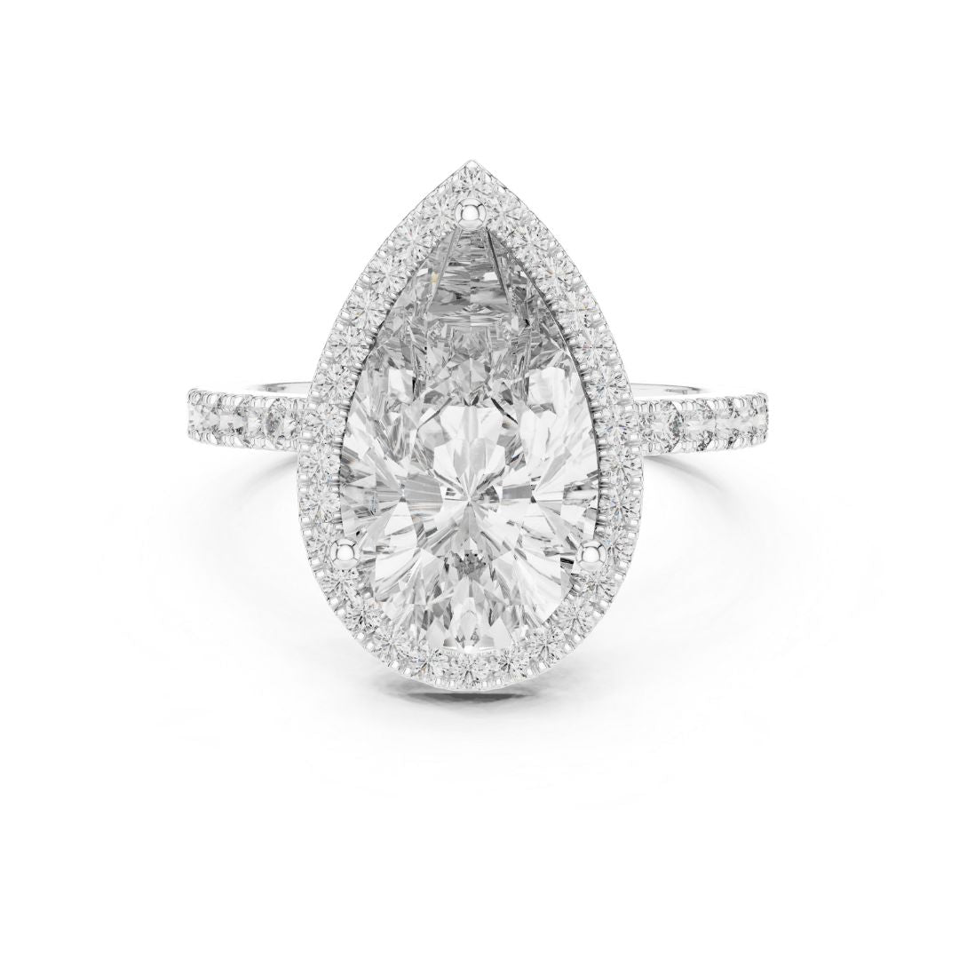 Teardrop-shaped moissanite diamond ring with a halo of smaller diamonds on a white background