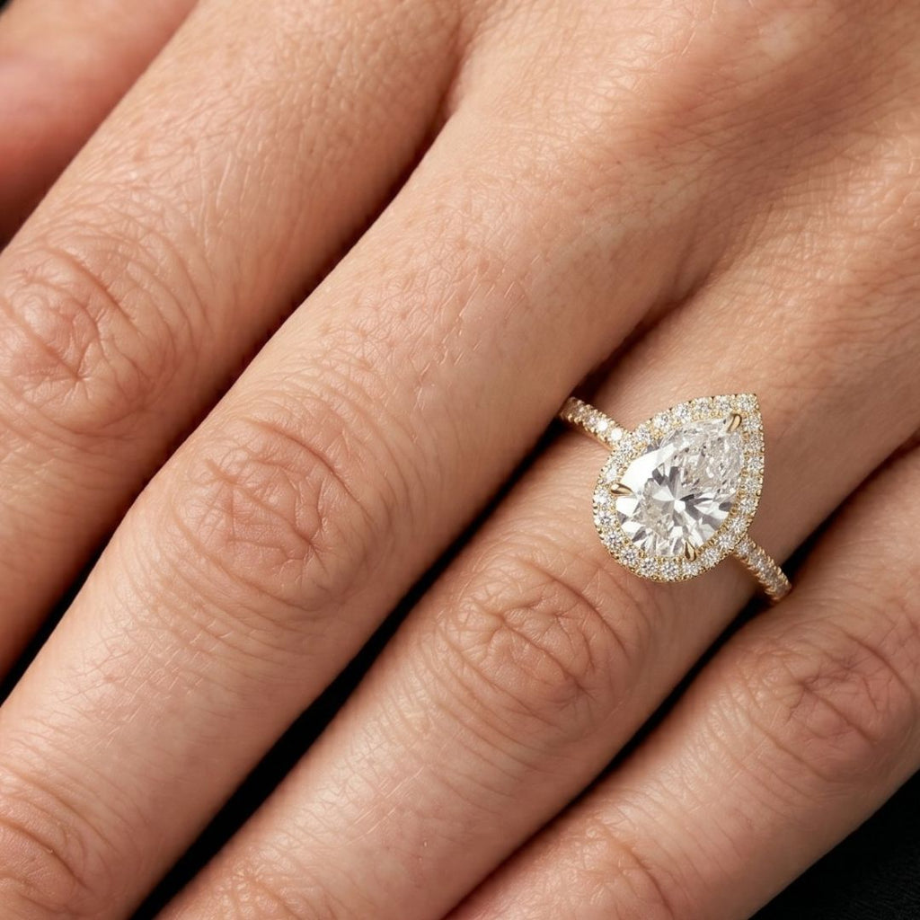 moissanite Diamond ring on a person's finger with a close-up view