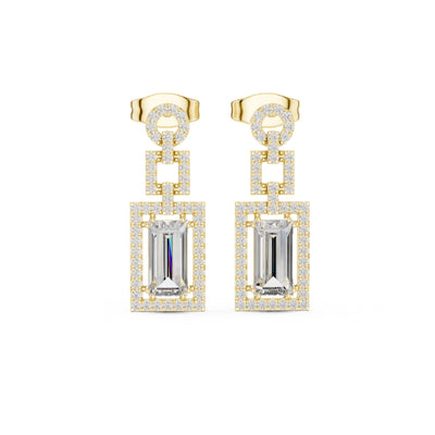 Gold and silver moissanite earrings with rectangular gemstones on a white background