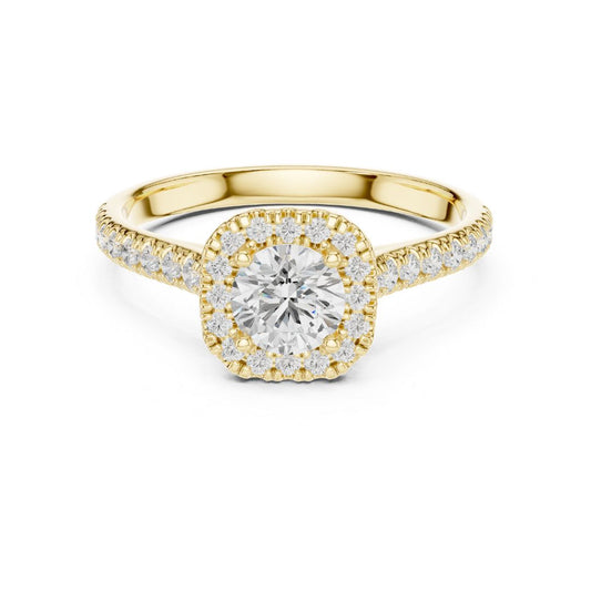Gold ring with a moissanite diamond on a white background