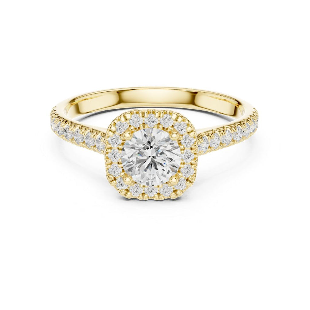 Gold ring with a moissanite diamond on a white background