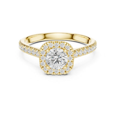 Gold ring with a moissanite diamond on a white background