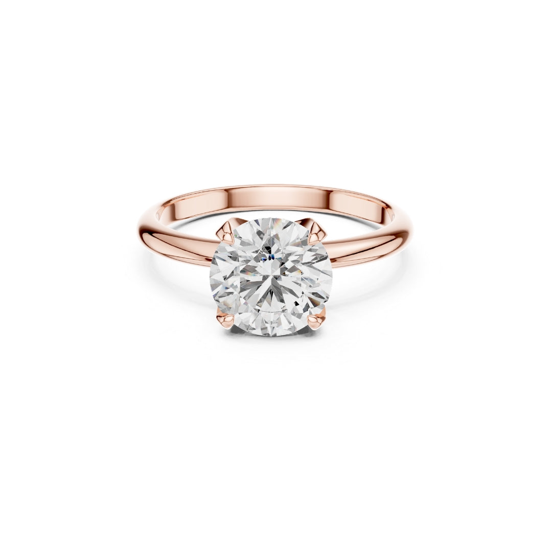 Rose gold ring with a 1ct Moissanite diamond on a white background