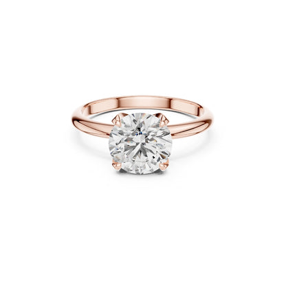 Rose gold ring with a 1ct Moissanite diamond on a white background
