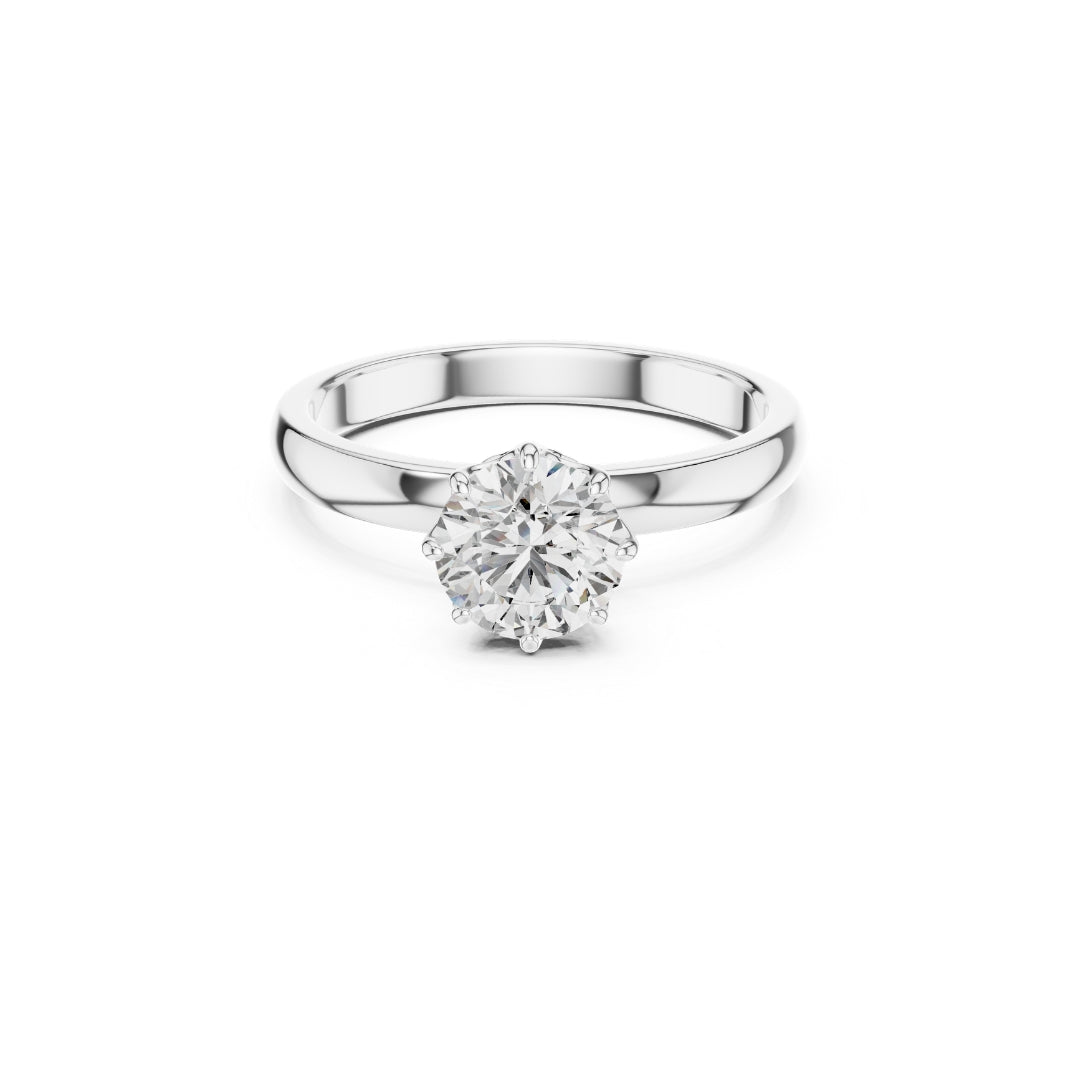 Silver ring with a 1ct moissanite diamond on a white background