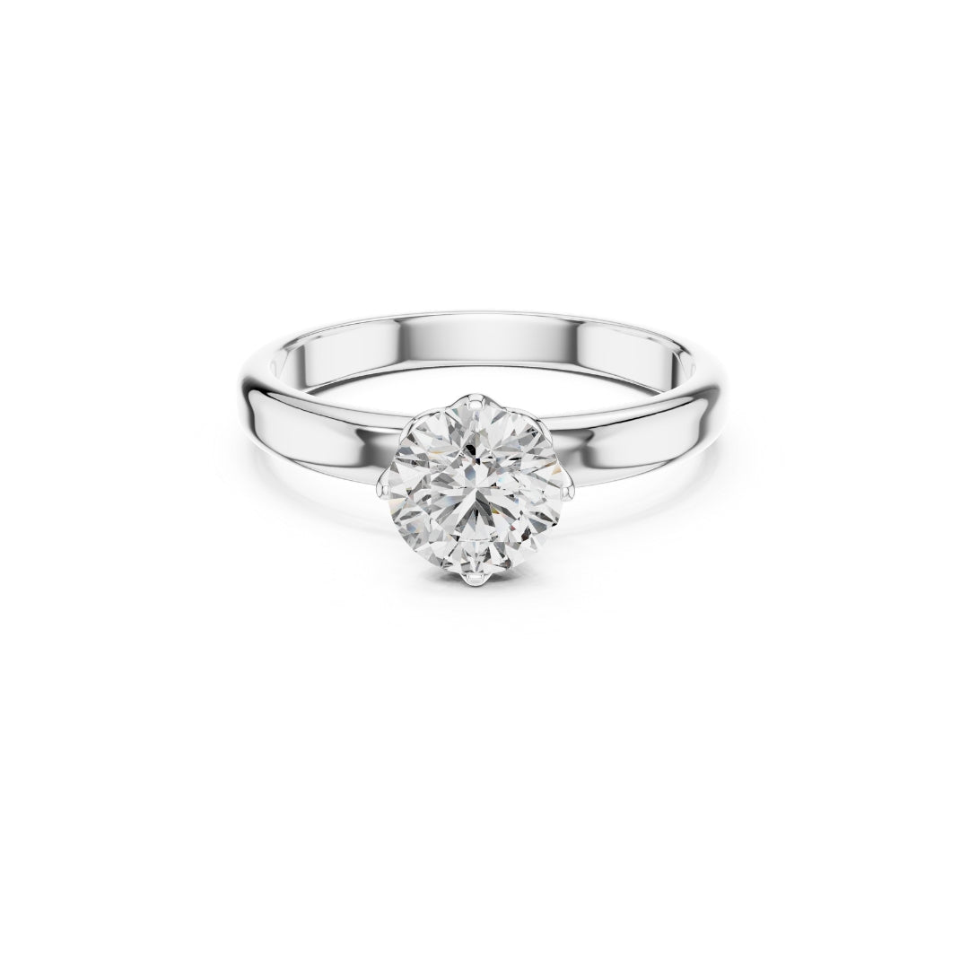 Silver ring with a 1ct moissanite diamond on a white background