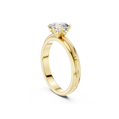 Gold ring with a 1ct moissanite diamond on a white background
